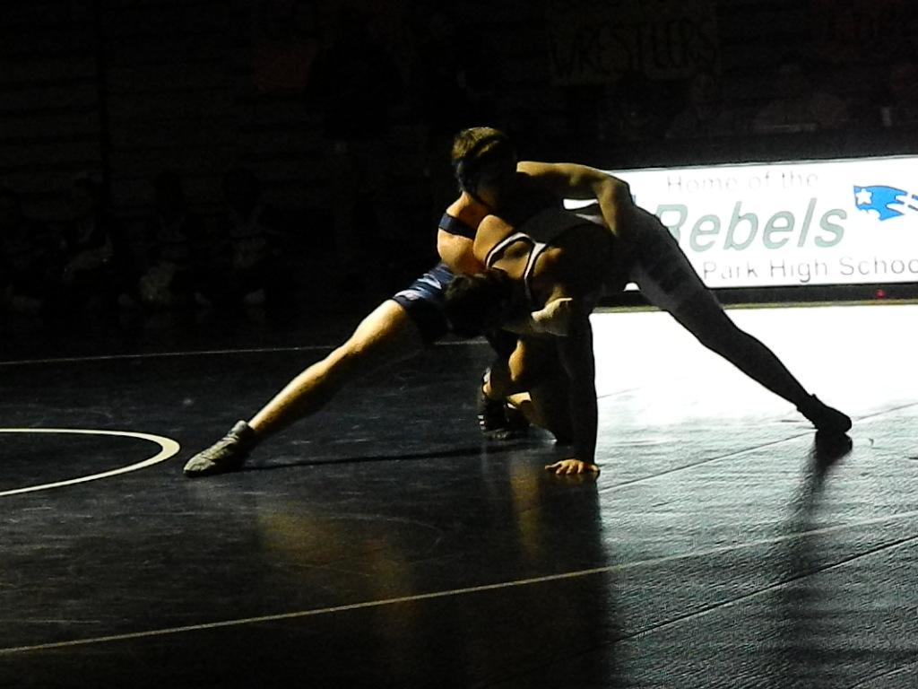 Captain Caleb Butler (11) sets his opponent up for a take-down.