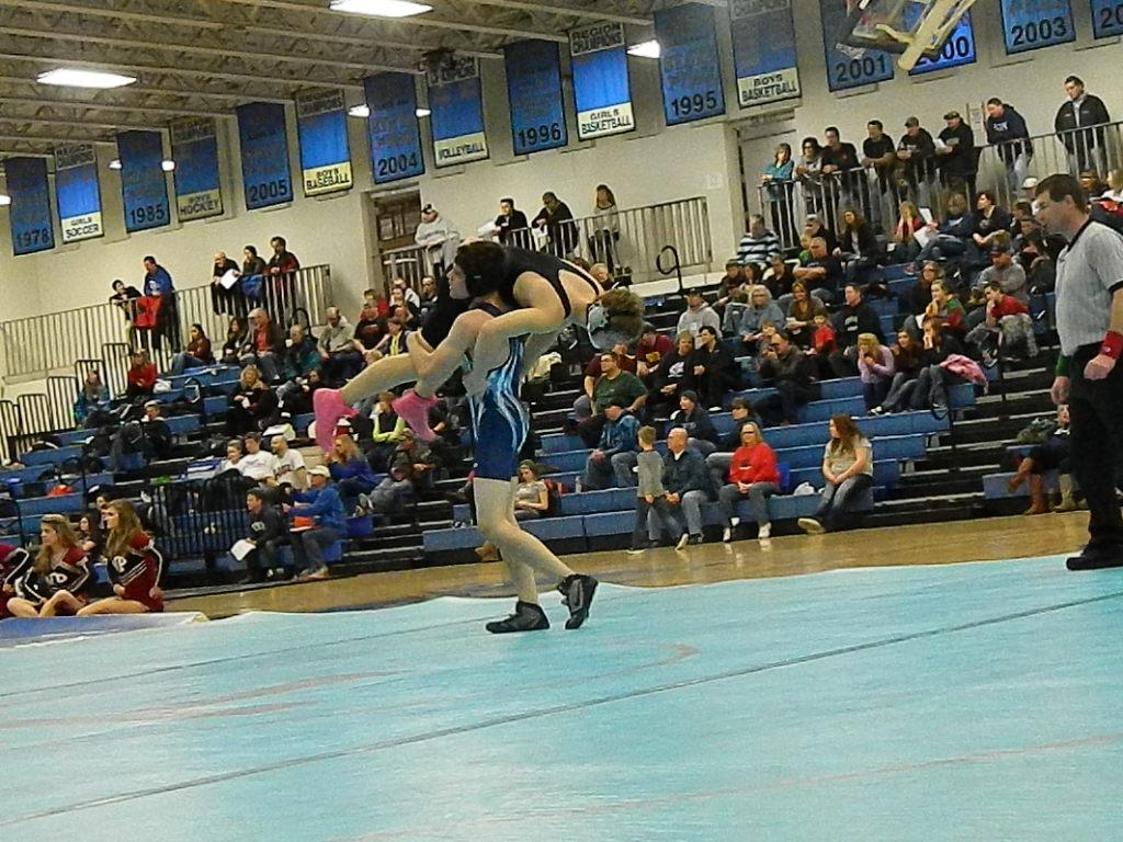 Jameson Allen (11) carried his opponent to the center of the mat for a hard earned pin.
