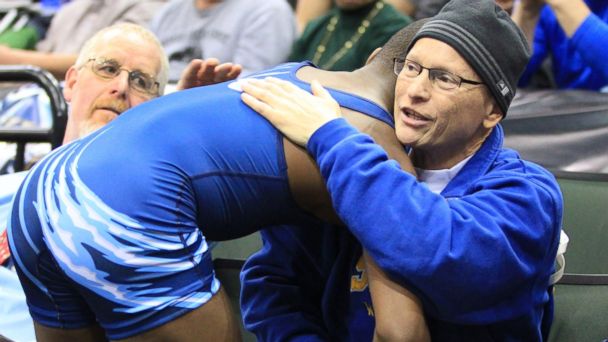 Malik Stewart embracing his predecessors terminally ill father