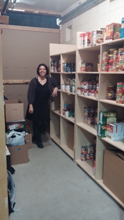 Administrator Cassidy Pohl stands proudly by her stock pile for the Tiger Takeout 