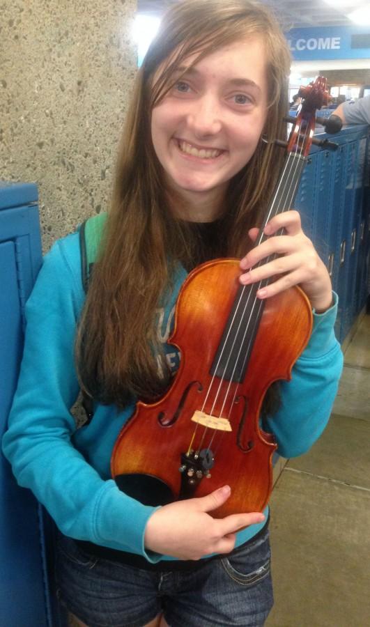 Katherine Ziebol holding her violin