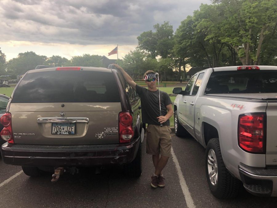 Nate Kinney in front of his 2004 Dodge Durango